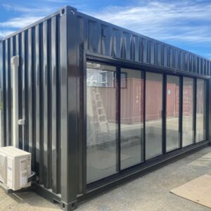 New 20′ high cube container and added large glass sliding door